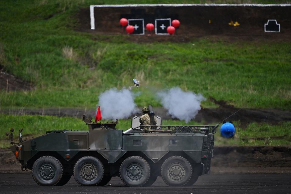A soldier fires a Type-01 anti-tank missile from a light armored vehicle during the Japan Ground Self-Defense Forces' annual live fire exercise at the Higashi-Fuji firing range in Gotemba in Shizuoka prefecture, May 23, 2020. / Credit: CHARLY TRIBALLEAU/POOL/AFP/Getty