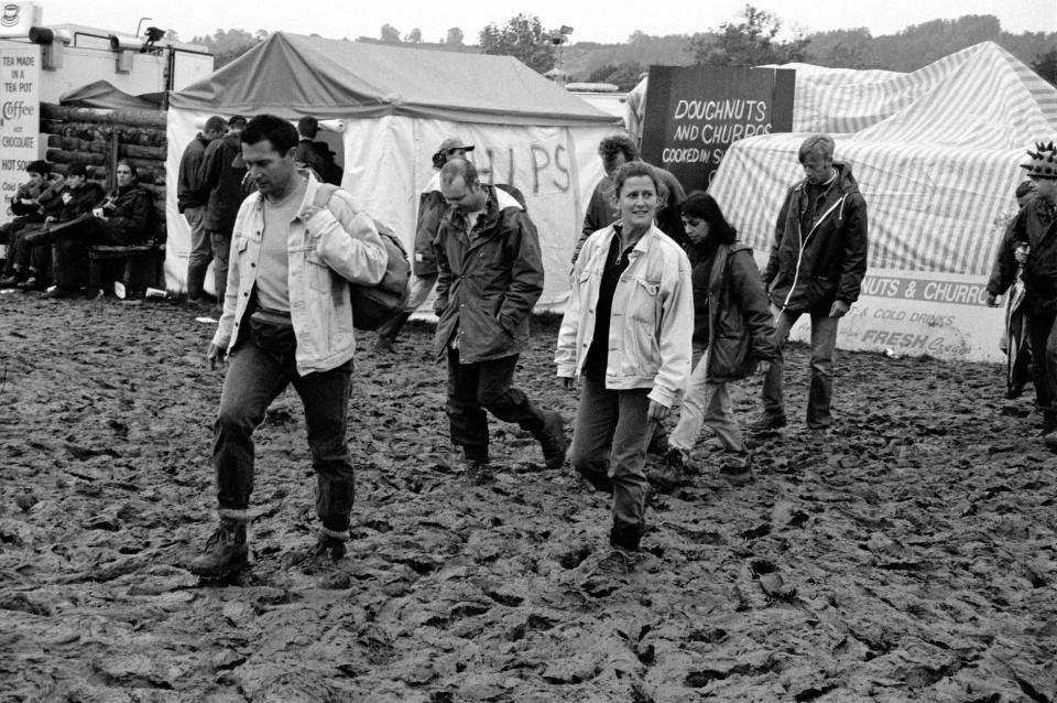 Muddy  market area Glastonbury Music Festival 1997, Worthy Farm, Somerset, England, United Kingdom.