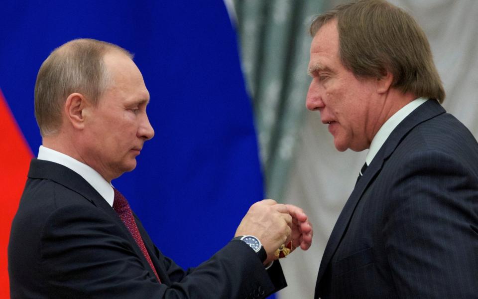 Sergei Roldugin, right, has been dubbed 'Putin's Wallet' - REUTERS/Ivan Sekretarev