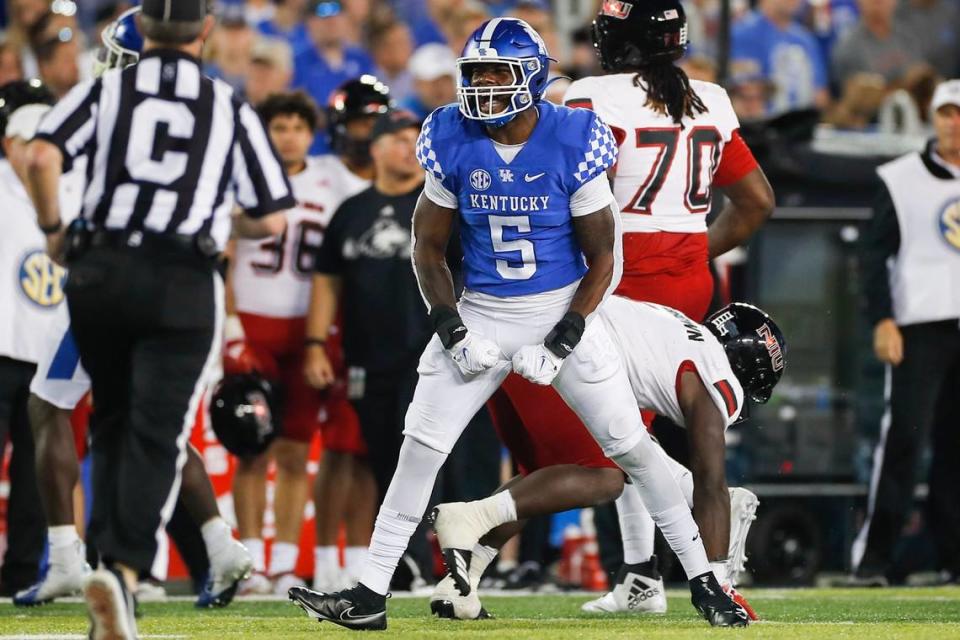 Kentucky linebacker DeAndre Square celebrates after a play against Northern Illinois during Saturday’s game at Kroger Field.