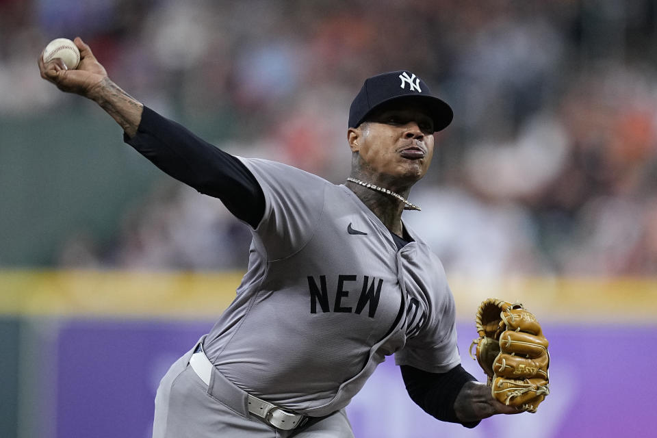 New York Yankees starting pitcher Marcus Stroman delivers during the first inning of a baseball game against the Houston Astros, Saturday, March 30, 2024, in Houston. (AP Photo/Kevin M. Cox)