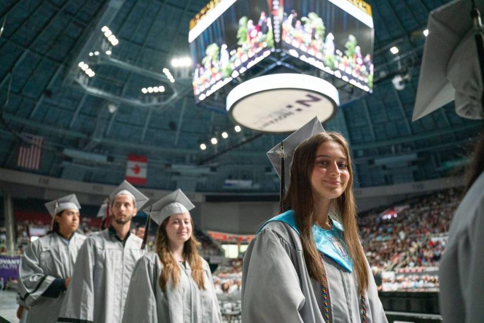 David W. Butler High School graduates line up before going onto the stage to receive their diplomas at the Bojangles Coliseum in Charlotte on Monday, June 10, 2024.