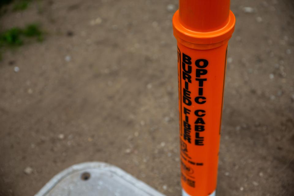 Newly installed fiber optic infrastructure sits outside Holland business Thursday, May 5, 2022, near Butternut Drive in Holland Township.