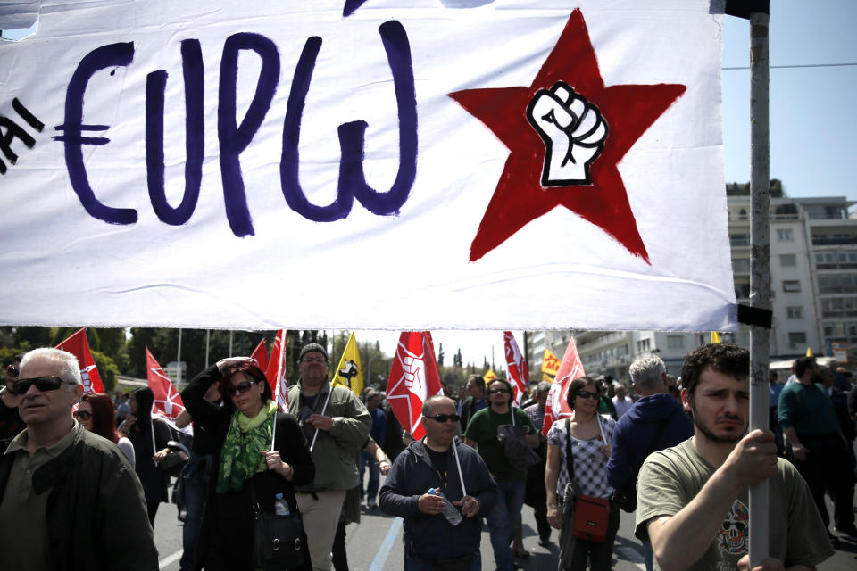 Protesters carry a banner during a 24-hour nationwide general strike, in Athens, Wednesday, April 9, 2014. Unions say they are seeking an end to the painful savings policies that successive governments imposed to secure international bailout loans after Greece nearly went bankrupt in 2010. The repeated income cuts and tax hikes deepened a six-year recession, while unemployment has reached a record 28 percent. (AP Photo/ Petros Giannakouris)