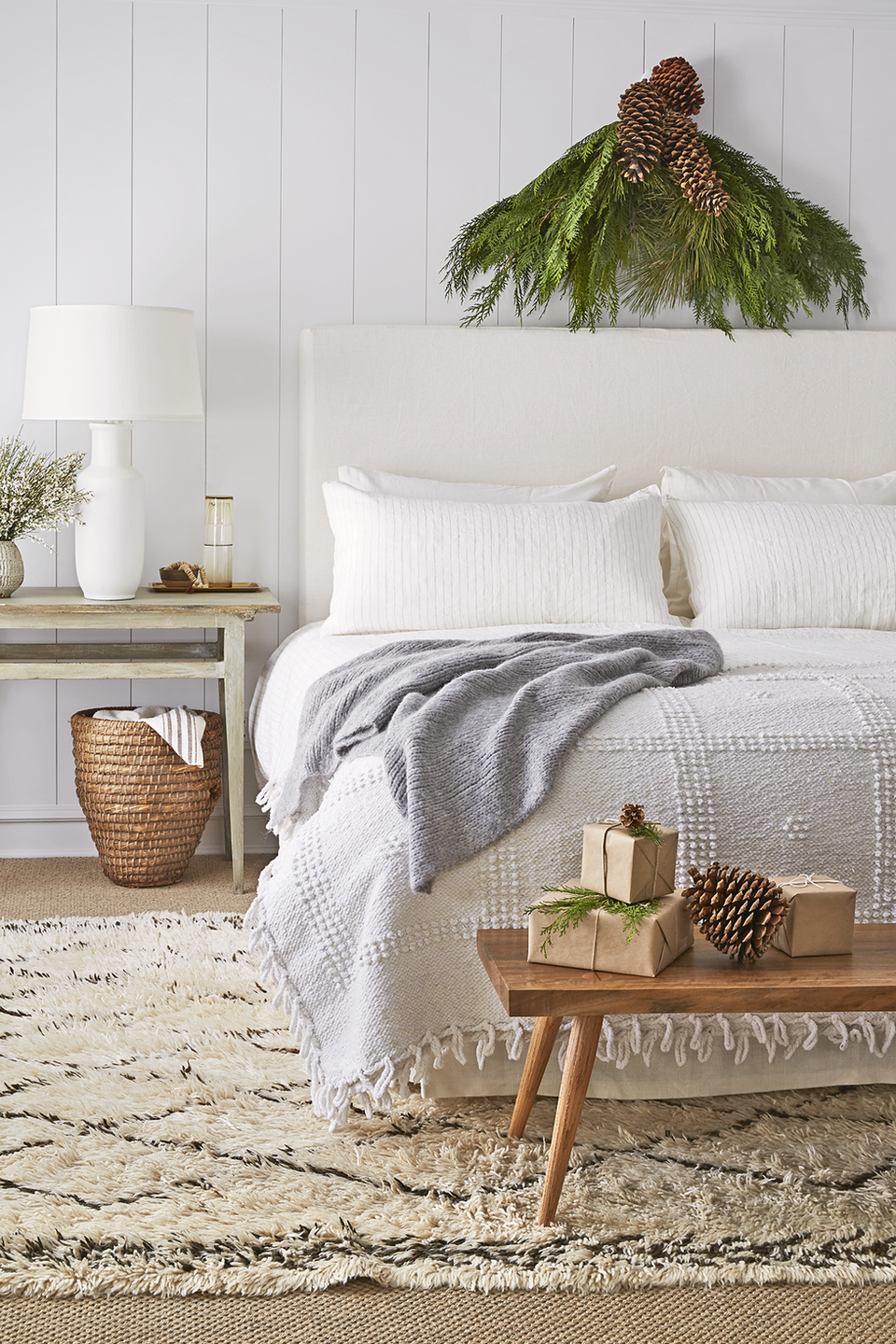 <p>Stick a freshly-cut bough above your headboard to bring the warm and cozy feeling into your bedroom. Then it's up to you whether you want to add in spruce accents to the rest of your space. </p>