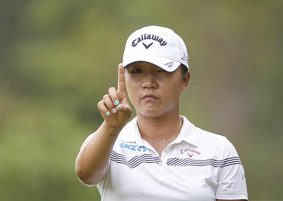 FILE - In this Oct. 28, 2016 file photo, Lydia Ko of New Zealand checks her line on the eleventh green during the second round of the LPGA golf tournament at Tournament Players Club (TPC) in Kuala Lumpur, Malaysia. A day ahead of the start of the Women's Australian Open at Royal Adelaide, the 21-year-old Thai golfer Ariya Jutanugarn also says she's not putting pressure on herself to overtake Ko for the No. 1 ranking. (AP Photo/Joshua Paul, File)