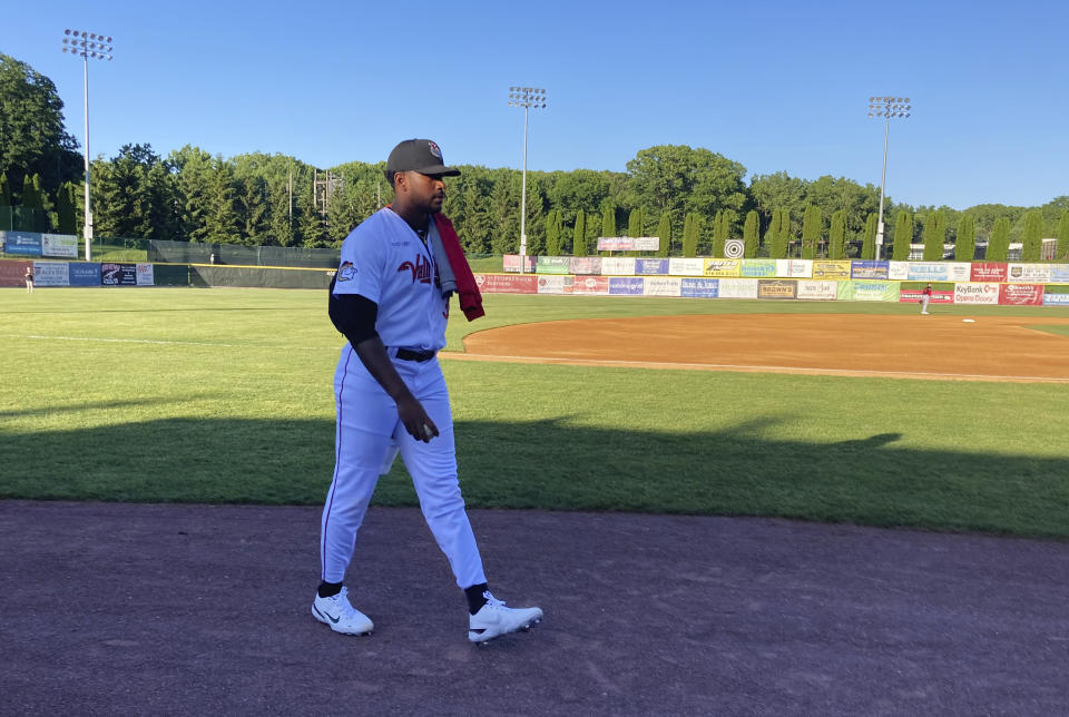 Former Vanderbilt star right-hander Kumar Rocker walks in from the bullpen at Joseph L. Bruno Stadium in Troy, N.Y., Saturday, June 4, 2022, prior to his first start for the Tri-City ValleyCats of the Class A independent Frontier League. Rucker was the 10th pick in last year’s MLB draft by the New York Mets but did not sign a contract when the Mets had concerns about his pitching arm. Rocker signed a contract with Tri-City that goes until about two weeks before the next MLB draft in July. (AP Photo/John Kekis)