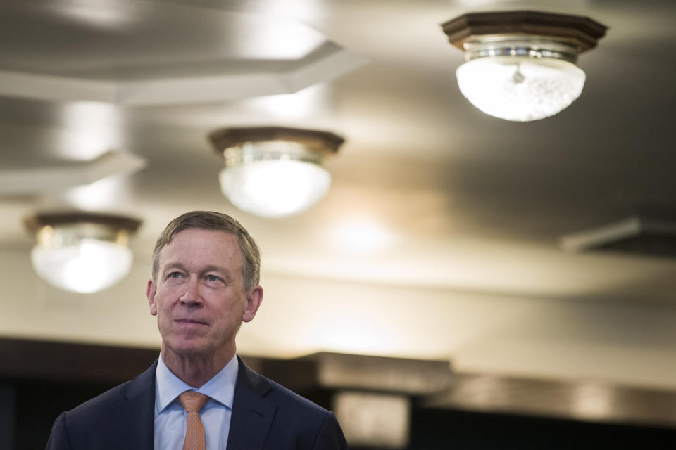 Former Colorado Governor John Hickenlooper waits as he is introduced before speaking during a media availability at the National Press Club, Thursday, June 13, 2019, in Washington. (AP Photo/Alex Brandon)