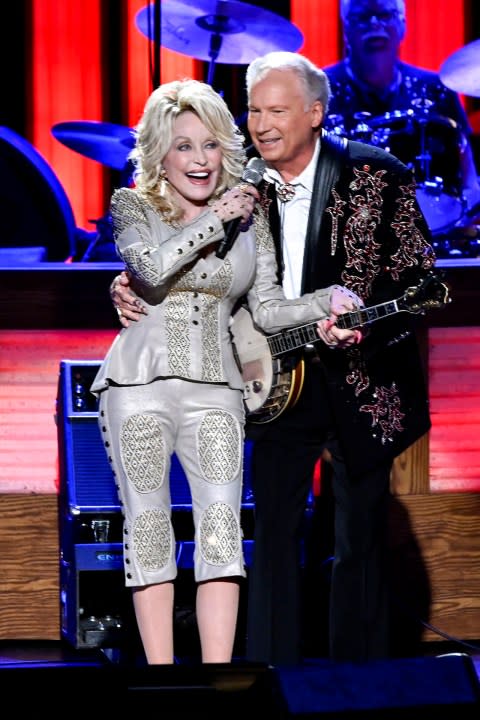 Dolly Parton and Buck Trent perform during “Dolly Parton: 50 Years at the Opry” in 2019. (Photo by: Katherine Bomboy/NBC/NBCU Photo Bank via Getty Images)