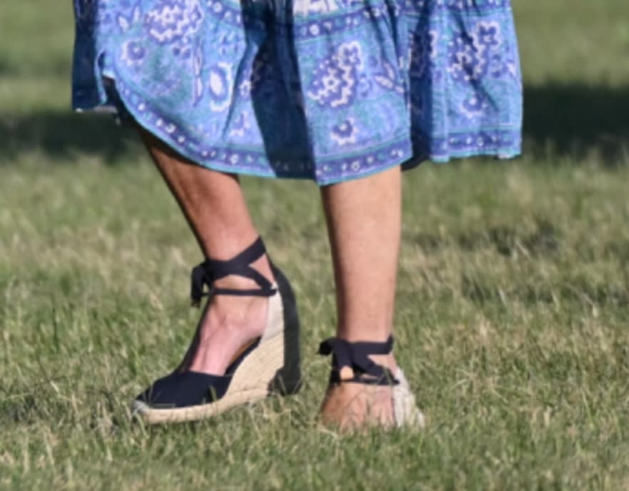 A closer look at the espadrilles worn by Jill Biden touching down at Fort McNair. Jill Biden is seen wearing espadrilles at Fort McNair in Washington. wedges, sandals, jill biden shoes, summer footwear, ankle wrap sandal