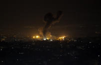 An explosion caused by Israeli airstrikes is seen on Gaza City, Wednesday, Jan. 15, 2020. Israel reportedly targeted several Hamas military sites in the northern Gaza strip after claims that Palestinian militants had fired four rockets at southern Israel. (AP Photo/Adel Hana)