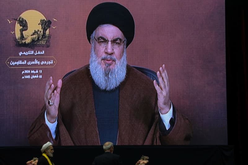 Hassan Nasrallah, Secretary-general of Hezbollah, speaks via a video link, during an event to mark the "Wounded Resistance Fighter Day". Marwan Naamani/dpa