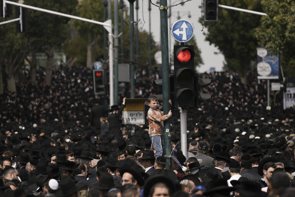 Ultra-Orthodox Jews attend the funeral of Rabbi Chaim Kanievsky in Bnei Brak, Israel Sunday, March 20, 2022. Kanievsky was one of the most influential scholars in the religious community in Israel. He died Friday at the age of 94. (AP Photo/Oded Balilty)