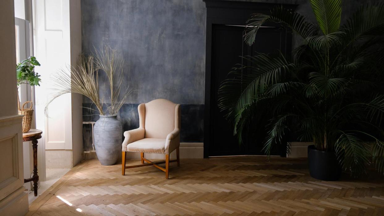 A living room with a beige armchair