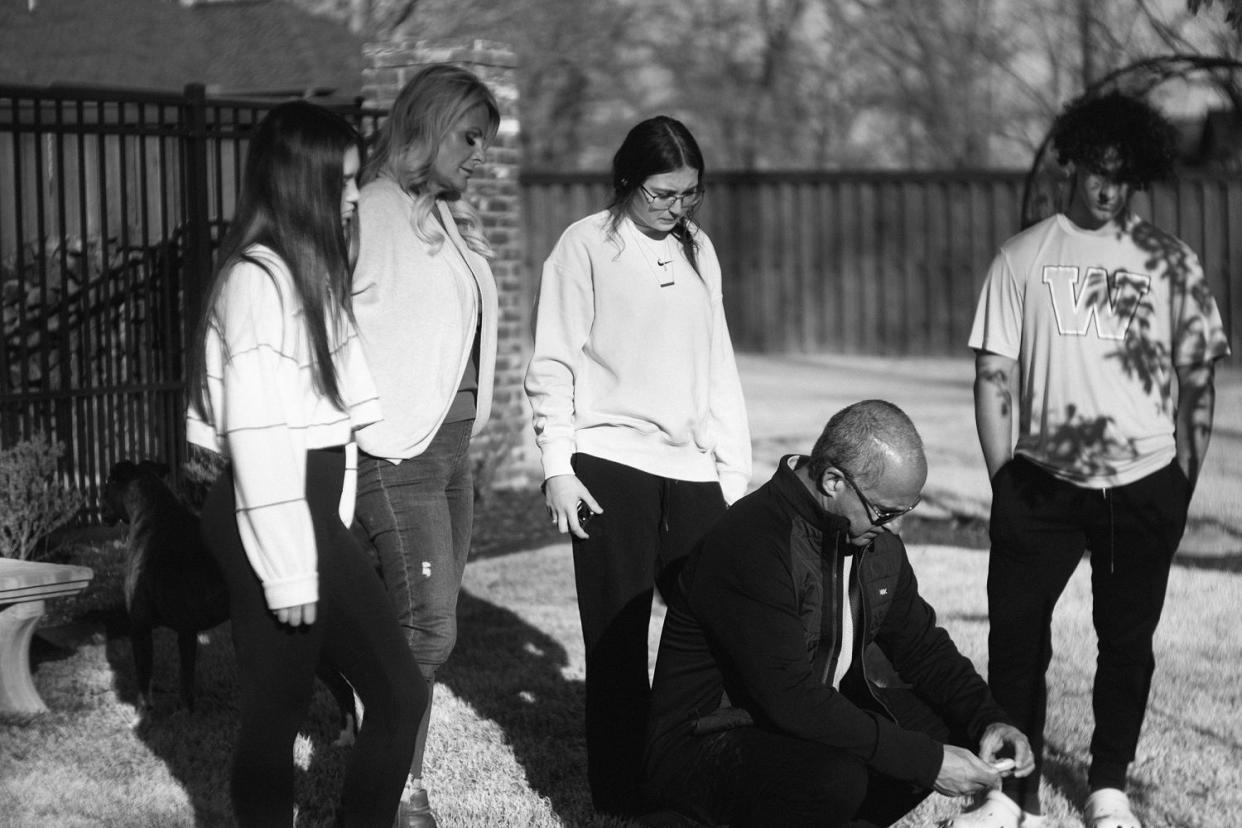 Mason's friend Maggie Stone; his mother, Jennie DeSerio; his friend Haylee Haynes; his stepfather, Dave; and his stepbrother, Anthony, gather at Mason's memorial garden at home in Centerton, Ark. (Micah McCoy for NBC News)