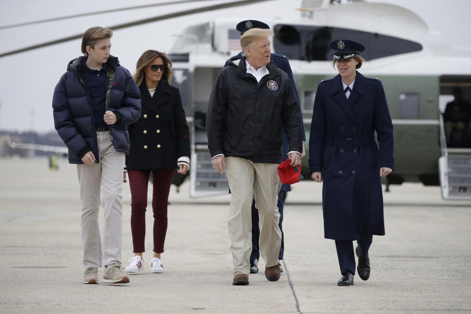 President Donald Trump, first lady Melania Trump and their son Barron Trump, walk to board Air Force One, Friday, March 8, 2019, in Andrews Air Force Base, Md., en route to Lee County, Ala., where tornados killed 23 people. (AP Photo/Carolyn Kaster)