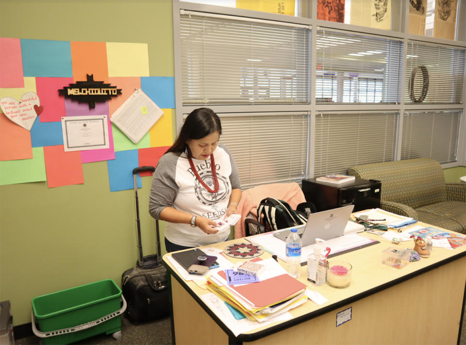 <em>Mildred Chiquito gets ready to welcome her students. Chiquito is in her second year teaching a Navajo language and culture class at Atrisco Heritage Academy High School. (Bella Davis</em>)