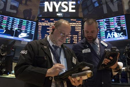 Traders work on the floor of the New York Stock Exchange May 2, 2014. REUTERS/Brendan McDermid