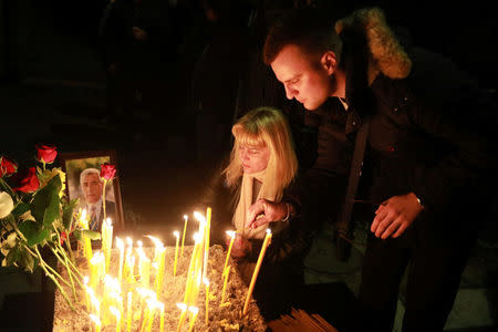 People gather to commemorate Kosovo Serb leader Oliver Ivanovic in front of his house in Kosovska Mitrovica, Serbia, January 16, 2018. REUTERS/Djordje Kojadinovic