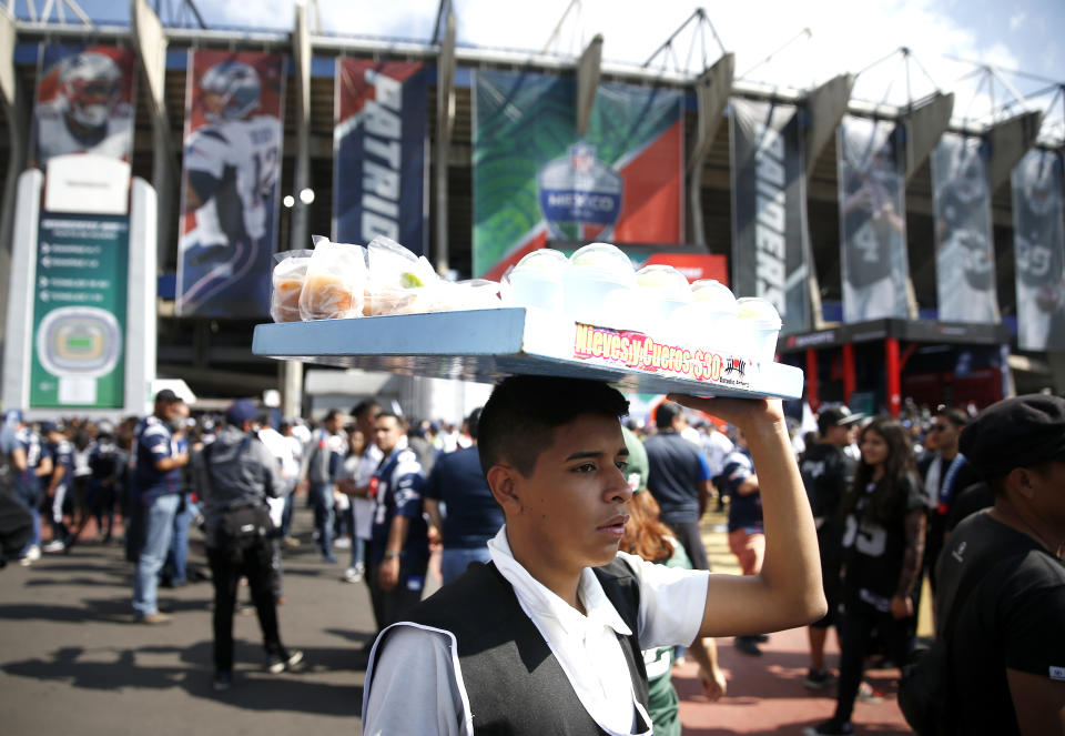 MEXICO CITY, NOVEMBER 19: A vendor sells snacks outside of Estadio Azteca before the start of the 2017 NFL Mexico Game between the New England Patriots and Oakland Raiders in Mexico City, Nov. 19, 2017. (Photo by Jessica Rinaldi/The Boston Globe via Getty Images)