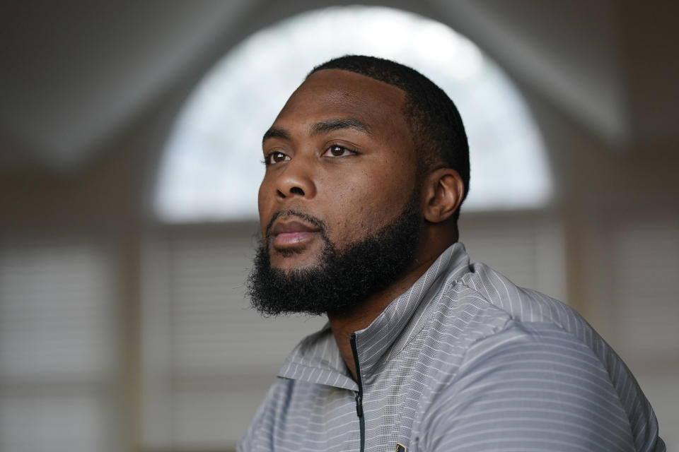 Carlton Shelley II poses for a picture at his home in West Orange, N.J., Tuesday, Nov. 23, 2021. Shelley was recruited to play football for West Point from high school and entered the academy in 2009. On the field, he described the team as “a brotherhood,” where his skin color never impacted how he was treated, though off the field, he said, he and other Black classmates too often were treated like the stereotype of the angry Black man. (AP Photo/Seth Wenig)