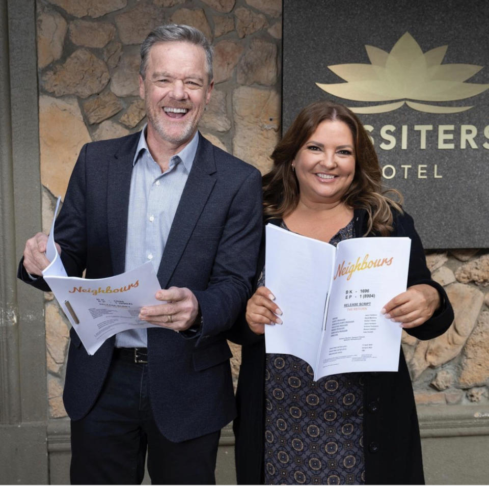 Neighbours couple Paul (Stefan Dennis) and Terese (Rebekah Elmaloglou) holding scripts in a promo shot for  the reboot. 