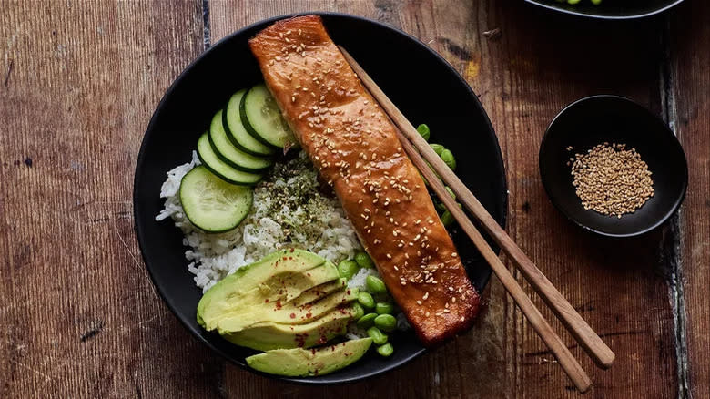 miso teriyaki salmon with chopsticks