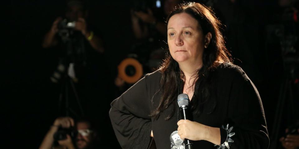 Kelly Cutrone standing with microphone