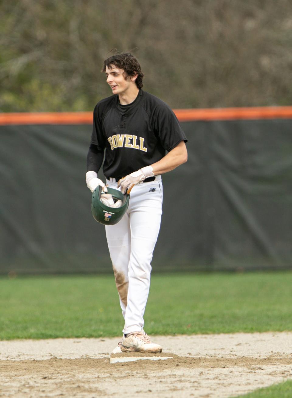 Jackson Militello of Howell stands on second base after one of his two doubles in the first game against Brighton on Wednesday, May 4, 2022.