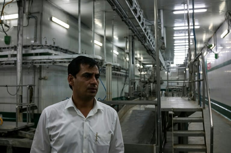 Haji Shadab, the managing director of a slaughterhouse, looks on inside the empty abattoir in Meerut, India