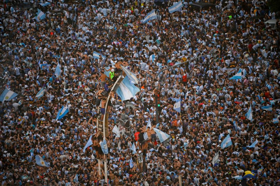 In this aerial view fans of Argentina celebrate winning the Qatar 2022 World Cup against France at the Obelisk  in Buenos Aires, on December 18, 2022. (Photo by Luis ROBAYO / AFP) (Photo by LUIS ROBAYO/AFP via Getty Images)