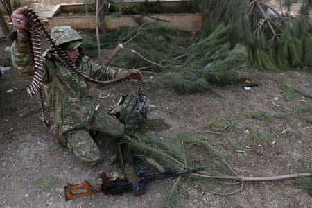 A rebel fighter arranges shells on the outskirts of the northern Syrian town of al-Bab, Syria February 8, 2017. REUTERS/Khalil Ashawi