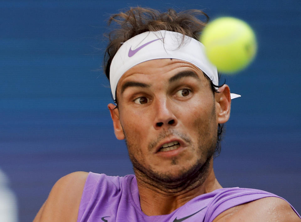 Rafael Nadal, of Spain, returns a shot to Hyeon Chung, of South Korea, during round three of the US Open tennis championships Saturday, Aug. 31, 2019, in New York. (AP Photo/Eduardo Munoz Alvarez)