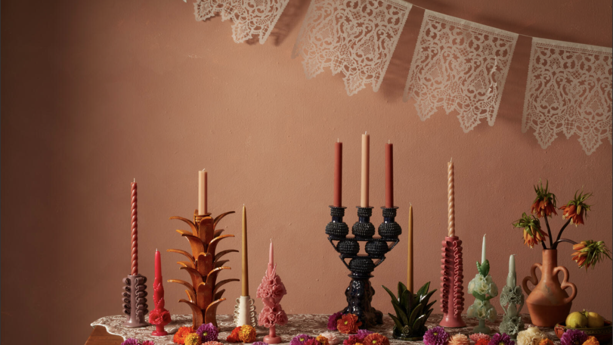 a table with candles and flowers