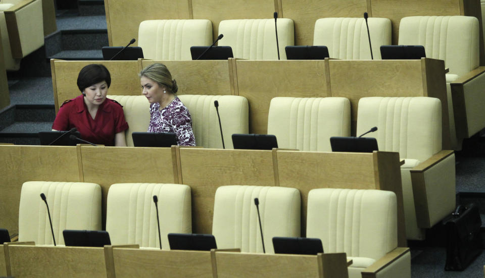 Members of the State Duma, lower parliament chamber, seen during a session in Moscow, Russia, Tuesday, July 10, 2012. Russia's parliament is due to ratify an agreement for Russia to join the World Trade Organization in a move that will push Moscow to open up its economy. (AP Photo/Misha Japaridze)