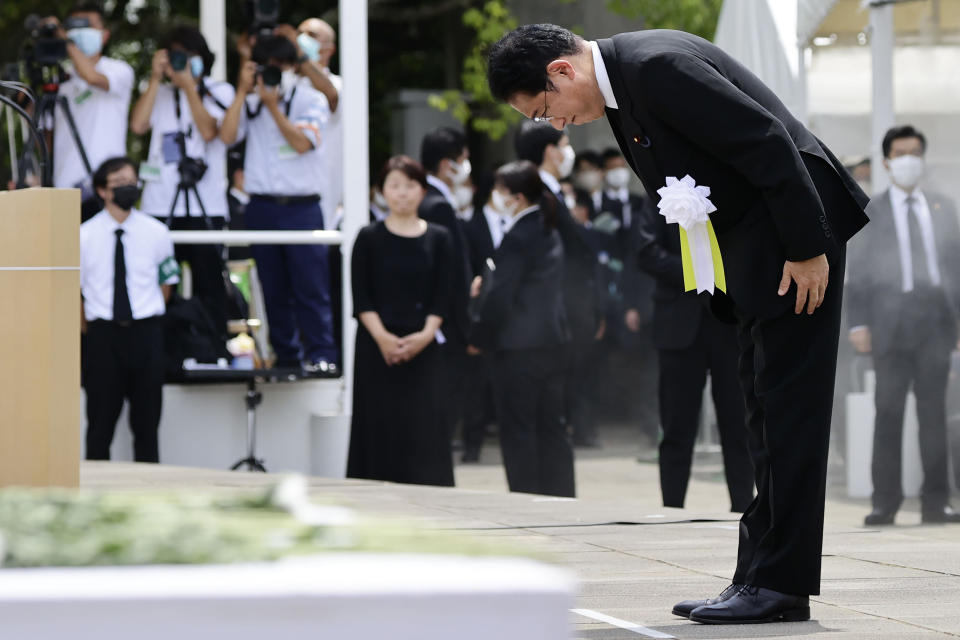 Japanese Prime Minister Fumio Kishida bows during a ceremony to mark the 77th anniversary of the atomic bombing in Nagasaki, southern Japan, Tuesday, Aug. 9, 2022. (Kyodo News via AP)
