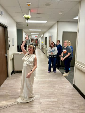 <p>Saint Luke's East Hospital</p> Sara Perry tosses her wedding bouquet