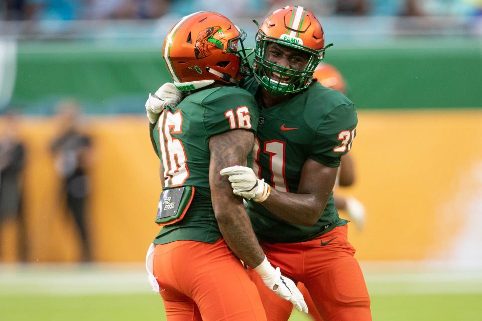 Florida A&M University defensive back Winsome Frazier (16) and Florida A&M University linebacker Isaiah Land (31) celebrate during the Orange Blossom Classic between Florida A&M University and Jackson State University at Hard Rock Stadium in Miami Gardens, Fla. Sunday, Sept. 5, 2021. 