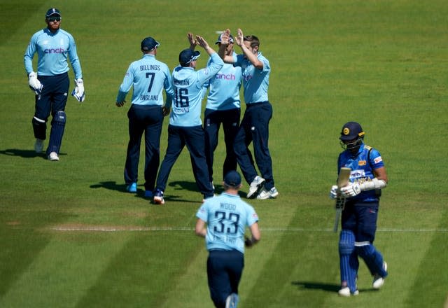 England celebrate after Sri Lanka's Dasun Shanaka is caught out by Jonny Bairstow, bowled by Chris Woakes 