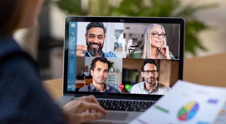 Person Working From Home Having Online Group Videoconference On Laptop