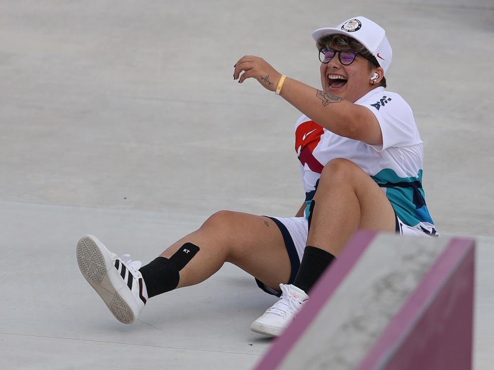 Alana Smith of the U.S. laughs after falling at the Tokyo Olympics.