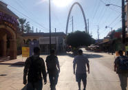 Expelled migrants walking in Tijuana, Mexico, Oct. 8, 2020. President Donald Trump’s reshaping of U.S. immigration policy may be most felt in his undoing of asylum. The suspension of asylum and the introduction of “express deportations,” as migrants call them, have accelerated a shift in who's crossing the border illegally: more Mexican men who come for economic reasons and far fewer from Central America, Africa and elsewhere who seek asylum. (AP Photo/Elliot Spagat)