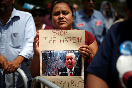 Supporter Maria Antonio waits for U.S. Democratic presidential candidate Bernie Sanders to speak in East Los Angeles, California, U.S. May 23, 2016. REUTERS/Lucy Nicholson