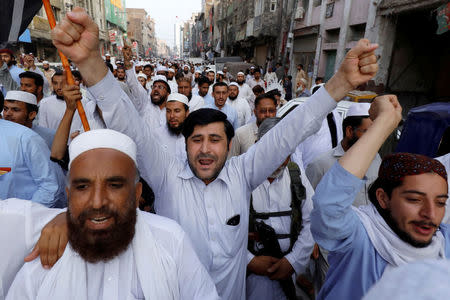 Supporters of the Muttahida Majlis-e-Amal (MMA), a coalition between religious-political parties, chant slogans against, what they say is alleged rigging by Election Commission of Pakistan (ECP) during general election, in Peshawar, Pakistan July 27, 2018. REUTERS/Fayaz Aziz