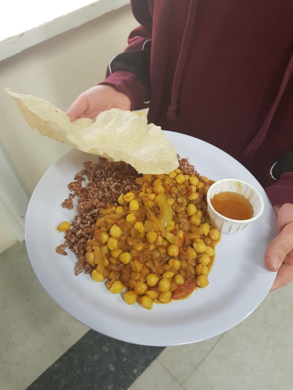 Chickpea curry, brown rice, poppadum and mango chutney (Collect/PA Real Life)