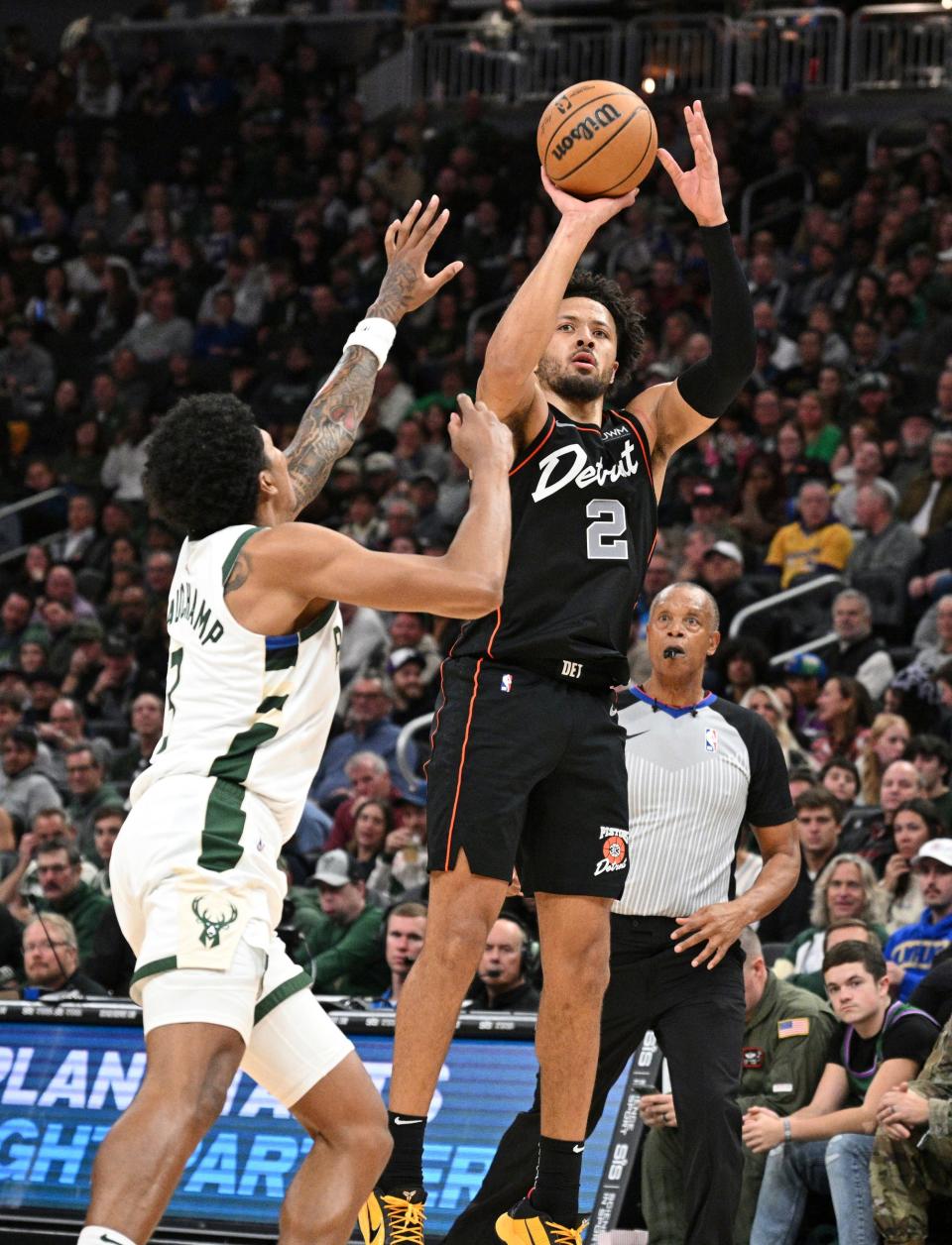 Pistons guard Cade Cunningham puts up a shot against Bucks forward MarJon Beauchamp in the first half on Wednesday, Nov. 8, 2023, in Milwaukee.