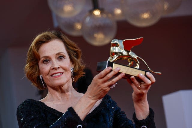 Sigourney Weaver poses with the lifetime achievement award