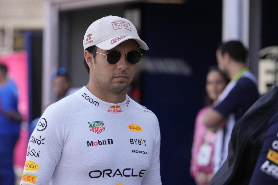 Red Bull driver Sergio Perez of Mexico arrives to the pits before the Formula One Monaco Grand Prix race at the Monaco racetrack, in Monaco, Sunday, May 26, 2024. (AP Photo/Luca Bruno)