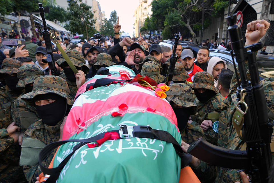 Islamic Group known as Jamaa Islamiya carry the body of their comrade Mohammad Riad Mohyeldin, who was killed in an apparent Israeli strike on Sunday, during his funeral procession in Beirut, Lebanon, Tuesday, March 12, 2024. (AP Photo/Bilal Hussein)