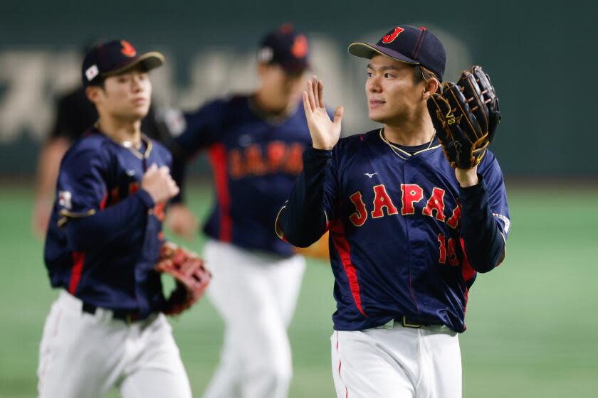 BUNKYO CITY, JAPAN - MARCH 12: Yoshinobu Yamamoto #18 of Team Japan reacts.